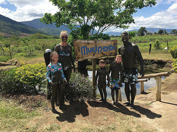 Family at thermal mud pool at Sabeto, Fiji